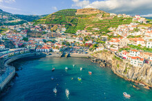 Aerial Drone View Of Camara De Lobos Village Panorama Near To Funchal, Madeira. Small Fisherman Village With Many Small Boats In A Bay