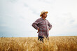 © maxbelchenko - Farmer in the wheat field. Growth nature harvest. Agriculture, gardening or ecology concept.