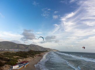 Water sport at cold winter water of Tyrrhenian sea between two touristic towns Sperlonga and Terracina in Lazio, Italy, aerial view