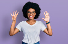 Young African American Woman Wearing Casual White T Shirt Showing And Pointing Up With Fingers Number Nine While Smiling Confident And Happy.