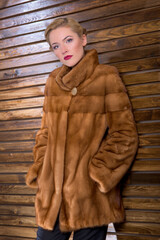 young woman in a fur coat made of natural fur..