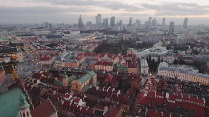 Wall Mural - January Sunset over the Warsaw Old City with skyscrapers in the background. Aerial Sunset oover Warsaw historical Old town and downtown skyline with skyscrapers, Poland. Reflections in the glass