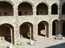 Open Courtyard With Cannon Balls In The Palace Of The Grand Master