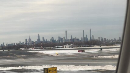 Fototapete - Airplane leaving New York City window view of Manhattan buildings skyline at LaGuardia airport departure