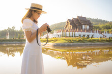 Asian Tourist Woman Visiting Ho Kham Royal Pavilion An Iconic Symbol Of Royal Park Rajapruek In Chiang Mai Province Of Thailand. 