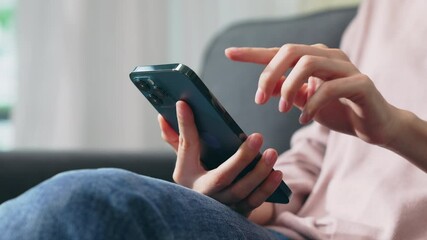 Wall Mural - Hand holding smartphone and chatting online on mobile, During leisure time.