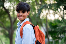 Portrait Student Boy With School Bag At The Park