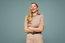 Middle Aged Woman Laughing Cheerfully In A Studio