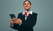 © Jacob Lund - Happy air hostess using a smartphone in a studio