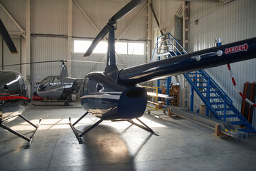 Three unmanned choppers housed in closed metal hangar