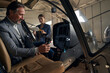 © Viacheslav Yakobchuk - Potential buyer choosing chopper in presence of aircraft hangar manager