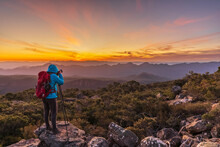 Australia, Victoria, Female Tourist Taking Pictures From Mount William At Sunset