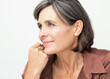 © Westend61 - Thoughtful woman with hand on chin against white background