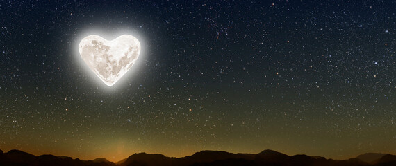 the moon heart-shaped shines over the lovers' house on valentine's day