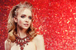© Miramiska - Luxurious woman on red wearing stunning jewelry. Beautiful woman on red background. Model in expensive rich necklace with precious stones.  Diamonds