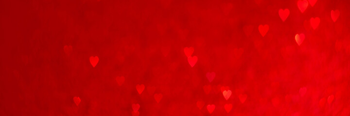Wall Mural - Red hearts, sparkling glitter bokeh background texture. Holiday valentines day lights. Abstract defocused header. Wide screen wallpaper. Panoramic web banner with copy space for design