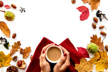 Autumn Frame Made Of Dried Leaves, Pine Cones, Berries, Acorns, Warm Scarf And Hand With Cup Of Coffee On White Background. Template Mockup Fall, Halloween. Flat Lay, Copy Space Background