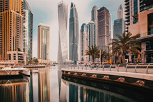 DUBAI, UAE - FEBRUARY 2018: View Of Modern Skyscrapers Shining In Sunrise Lights  In Dubai Marina In Dubai, UAE.