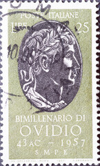 Wall Mural - Italy - circa 1957: a postage stamp from Italy showing the portrait of Bimillenario di Ovid (2,000 years since the birth of Ovid)