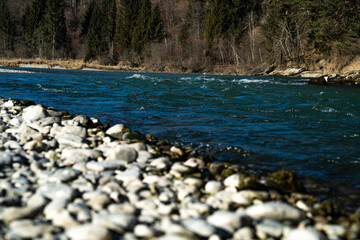 White rocks and stones at blue river