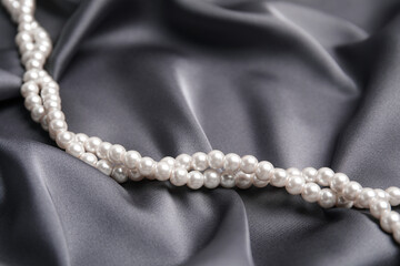 Canvas Print - Beautiful white pearls on delicate grey silk, closeup