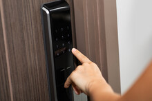 Hand And Digital Smart Code Lock Into The Modern Apartment