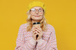 © ViDi Studio - Elderly smiling fashionable positive happy blonde caucasian woman 50s in pink sweater beret hat glasses hold takeaway delivery craft paper brown cup coffee to go isolated on plain yellow background