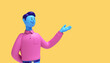 3d render. Cartoon character young man with blue skin wears pink shirt isolated on yellow background. Shows hand gesture. Presentation concept