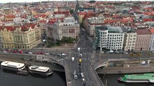 Aerial View Of City Traffic And Landmark Buildings On The Banks Of The Vltava River By Day In Prague, Czech Republic.