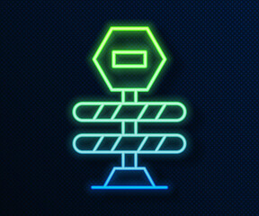 Poster - Glowing neon line Road barrier icon isolated on blue background. Symbol of restricted area which are in under construction processes. Repair works. Vector