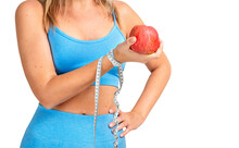 Girl Holding A Measuring Tape And An Apple Isolated