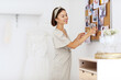 © Pixel-Shot - Female wedding planner working in office