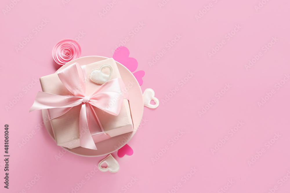 Present for Valentine day, hearts and rose bud on color background