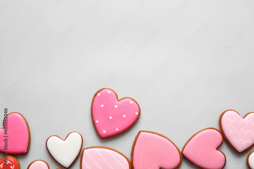 Tasty heart shaped cookies on light background