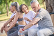 © zinkevych - Mid aged people resting in the park after the workout
