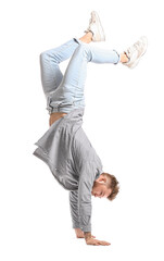 Wall Mural - Cool dancing young man isolated on white