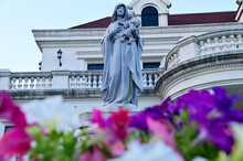 Close-up Of Statue Of Our Lady Of Grace Virgin Mary Located In Front Of The Church With Natural Background, Thailand. Selective Focus.