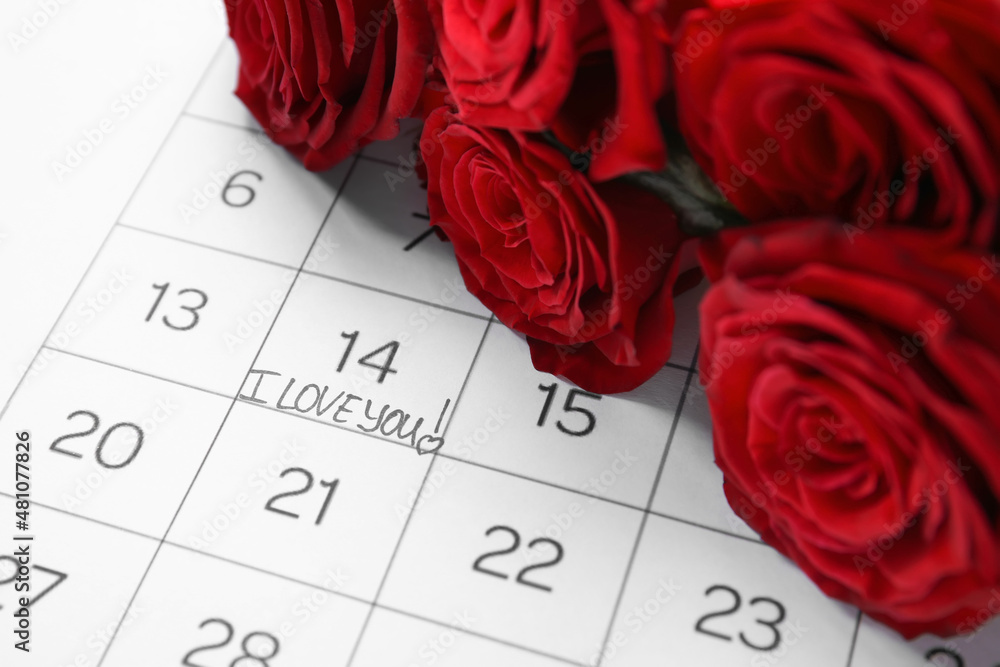 Calendar with text I LOVE YOU and roses, closeup. Valentine's Day celebration