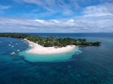 A Small Coral Island With A White Beach A Drone Picture 