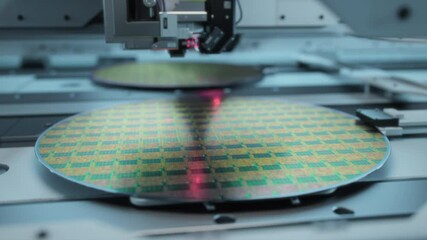 Shot of Silicon Wafer being processed at Semiconductor Foundry, that produces Computer Chips.