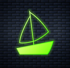 Poster - Glowing neon Yacht sailboat or sailing ship icon isolated on brick wall background. Sail boat marine cruise travel. Vector