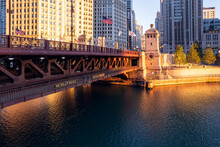 Downtown Cityscape And Michigan Avenue Bridge Over Chicago River At Sunrise, Chicago, Illinois, USA