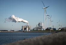 Fossil Fuel (coal) Power Station And Wind Turbines In The Eemshaven Generating Power. Energy Transition Concept.