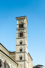 Wall Mural - The marbled bell tower of Prato cathedral, or Cathedral of Saint Stephen, in Romanesque style, Duomo square, Prato city, Tuscan region, Italy