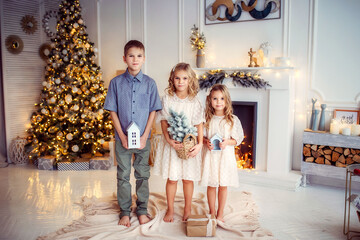 Wall Mural - children, new year, new year's interior, christmas tree, photo shoot in the studio, family, brother, sisters