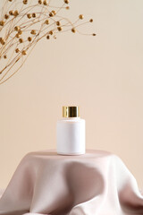 Wall Mural - cosmetic lotion bottle mockup on dais podium with dry flowers on beige background. natural beauty pr