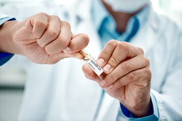 Canvas Print - Millions of lives depend on it. Cropped shot of a scientist opening an ampoule with 2019-nCov on it.