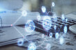 © peshkova - Multi exposure of data theme drawings and desk with open notebook background. Concept of education