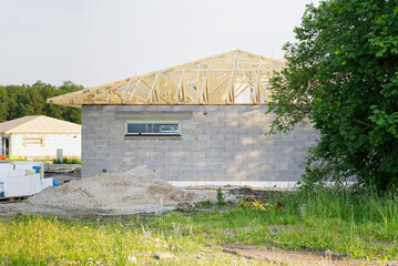 Wall Mural - The building structure of the house is made of concrete blocks. roof frame made of wooden beams. DIY private house construction.