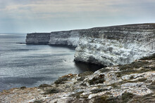 Cape By The Sea. Seascape, Horizon, Calm Blue Sea, Cloudy. Chalk Rocks, Cape Tarkhankut, Crimea. The Natural Texture Of White Stone.